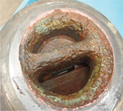 Galvanic corrosion of an NAB drain valve in a superduplex stainless steel high pressure line. Photo courtesy of Rolled Alloys