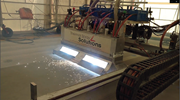 Photo of robotic machine thermal spray application.