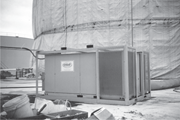 DH equipment installed beside a shrouded tank. Courtesy Enviro-Air Control Corp.