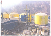 Four 7,500 metric ton sulfuric acid storage tanks used to store the acid that is produced by capturing SO2 from a copper smelter. These are carbon steel and have anodic protection systems to reduce corrosion.