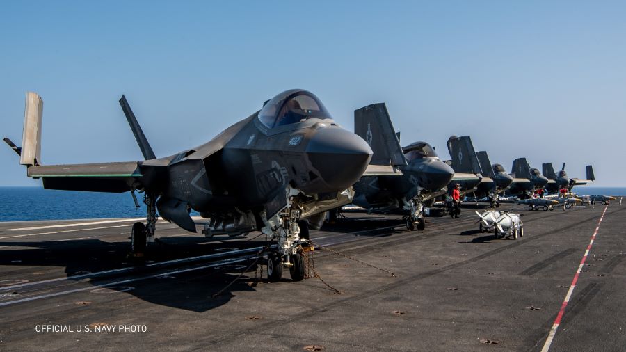 U.S. Navy personal load ordnance onto an F-35C Lightning II aircraft, attached to Strike Fighter Squadron (VFA) 97, on the flight deck of the Nimitz-class aircraft carrier USS Carl Vinson (CVN 70). Photo by Petty Officer 2nd Class Nathan Jordan.